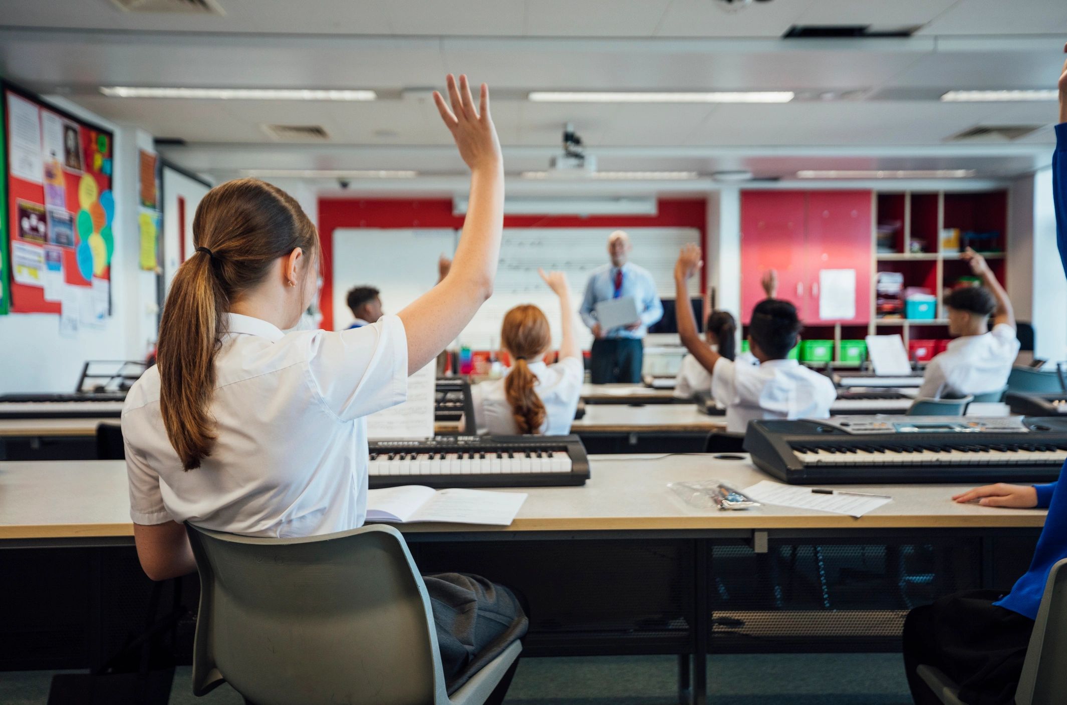 Music students learning together in a classroom